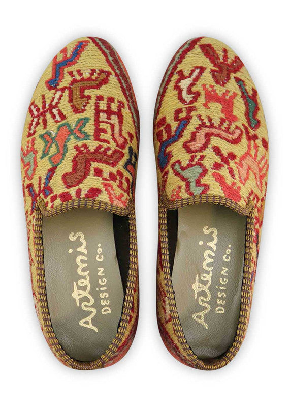 The Artemis Women's Smoking Shoe showcases a delightful color combination of red, white, blue, teal, khaki, peach, brown, and green. These smoking shoes offer a harmonious mix of vibrant and earthy tones, creating a stylish and versatile look. (Front View)