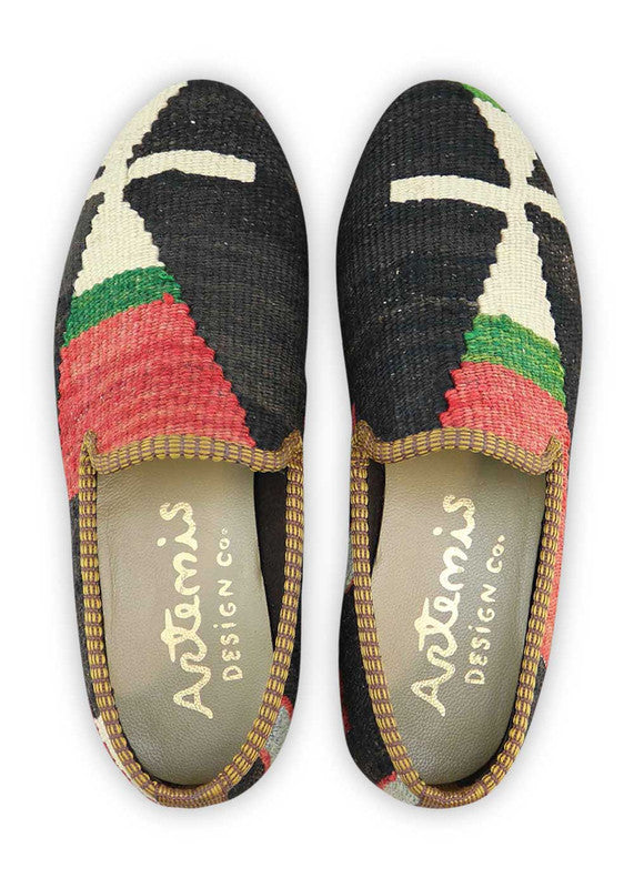 The Artemis Women's Smoking Shoe showcases a bold color combination of black, green, red, blue, and white. These smoking shoes offer a vibrant mix of contrasting tones, creating a chic and eye-catching look. Whether you're dressing up for a special occasion or seeking a comfortable yet stylish option for everyday wear, these shoes are the perfect choice. (Front View)