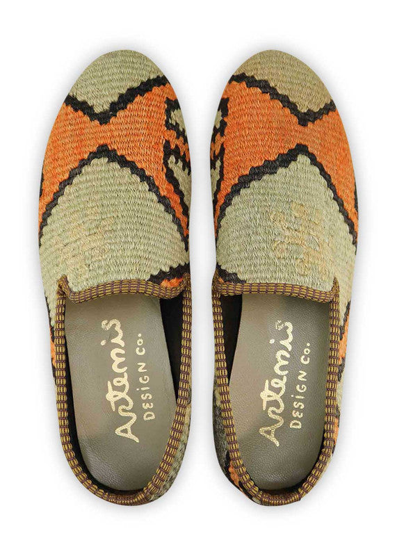 The Artemis Women's Smoking Shoe presents a chic color combination of khaki, orange, black, and grey. These smoking shoes offer a tasteful mix of earthy and vibrant tones, creating a stylish and versatile look. (Front View)